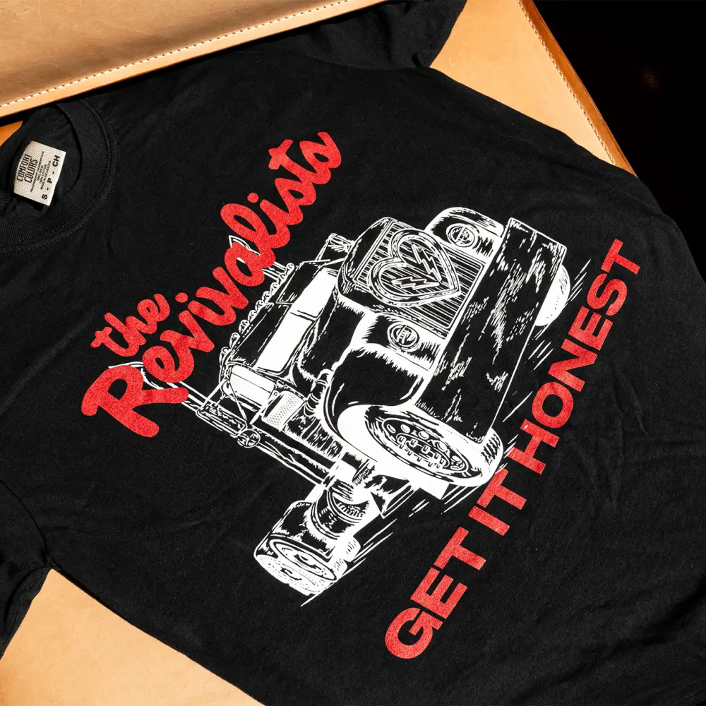 Black cotton driven tee featuring a white and red vintage truck graphic with the revivalists text in red script