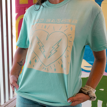 Mint green t-shirt featuring a white graphic design of a heart with lightning bolts.