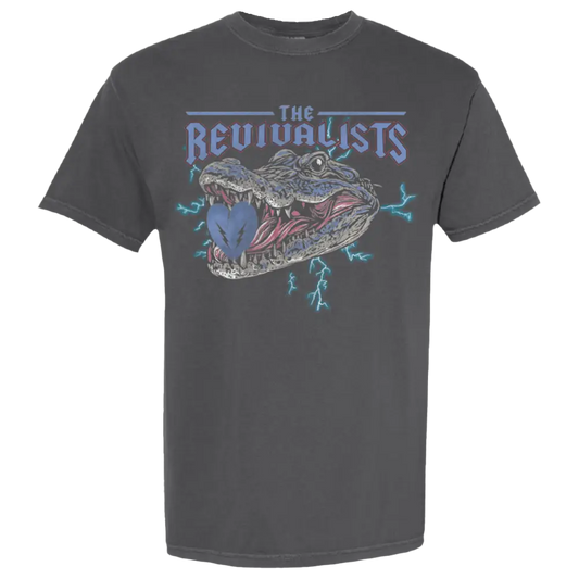 Dark gray t-shirt featuring a graphic design of an alligator’s open mouth with ’The Revivalists’ text above it.
