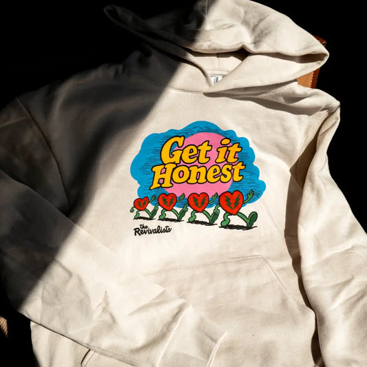 Cream-colored good company hoodie with vibrant get it honest graphic and red heart-shaped plants on front