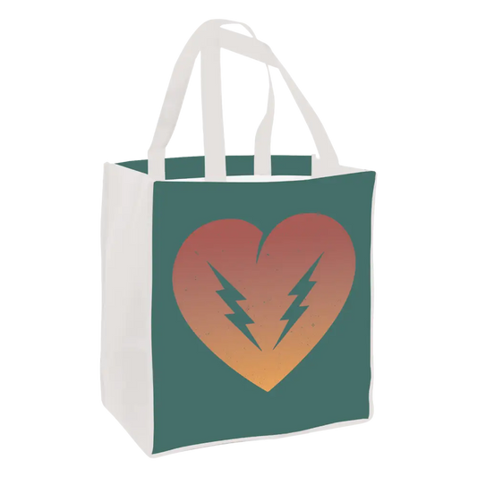 Tote bag with a heart and lightning bolt design on a teal background.