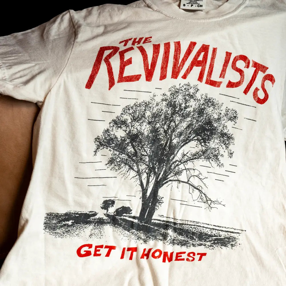 White cotton honest tee featuring black tree illustration with red the revivalists and get it honest text