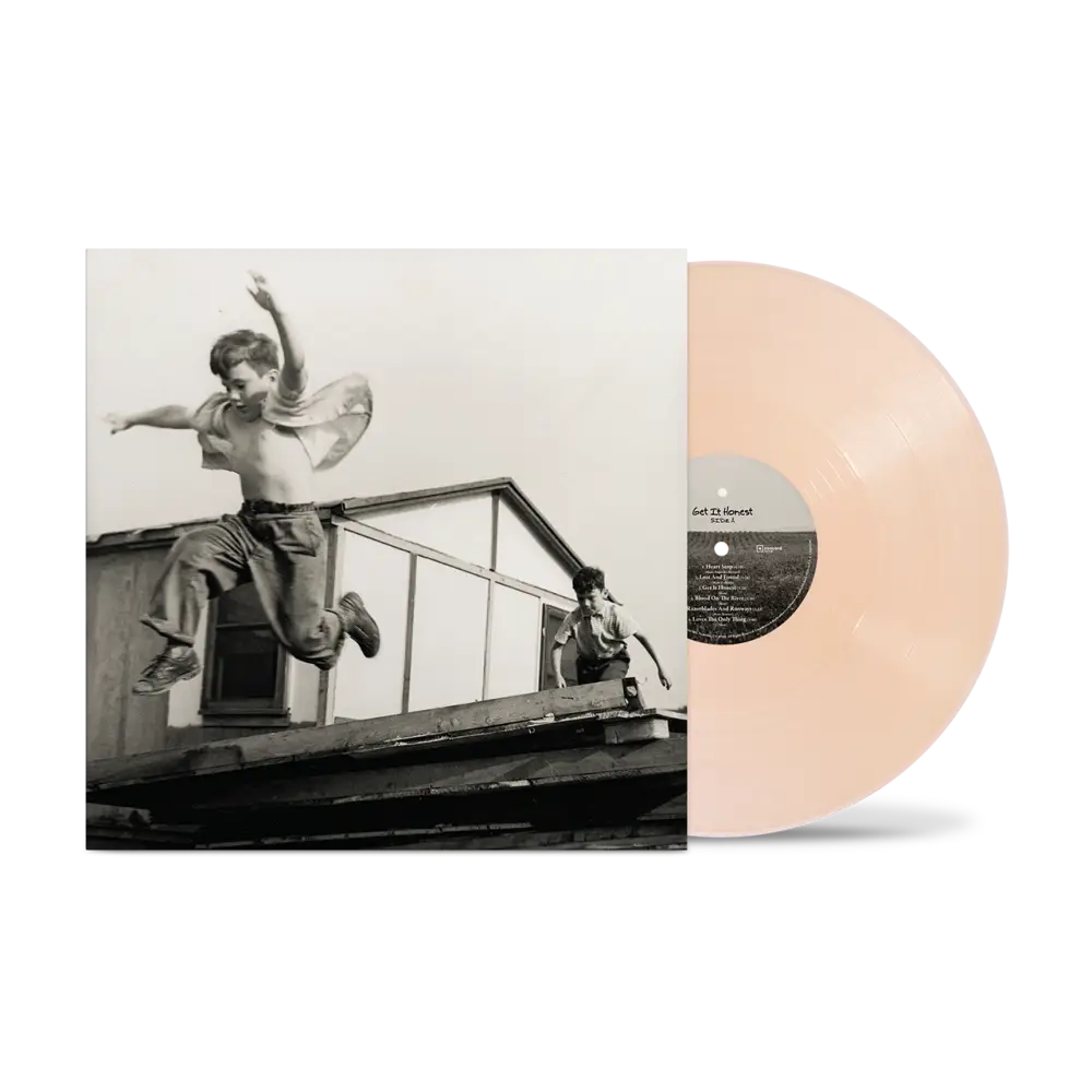 Pale peach vinyl record with black and white rooftop boys album cover in driven right fan pack pre-order