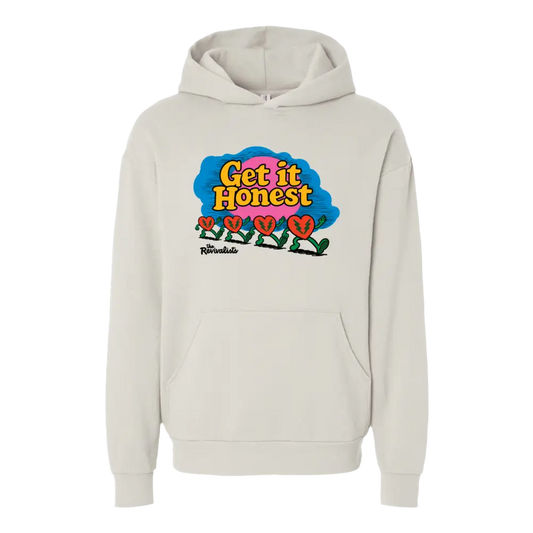 Cream-colored good company hoodie with vibrant yellow get it honest text and red hearts on blue pink cloud design