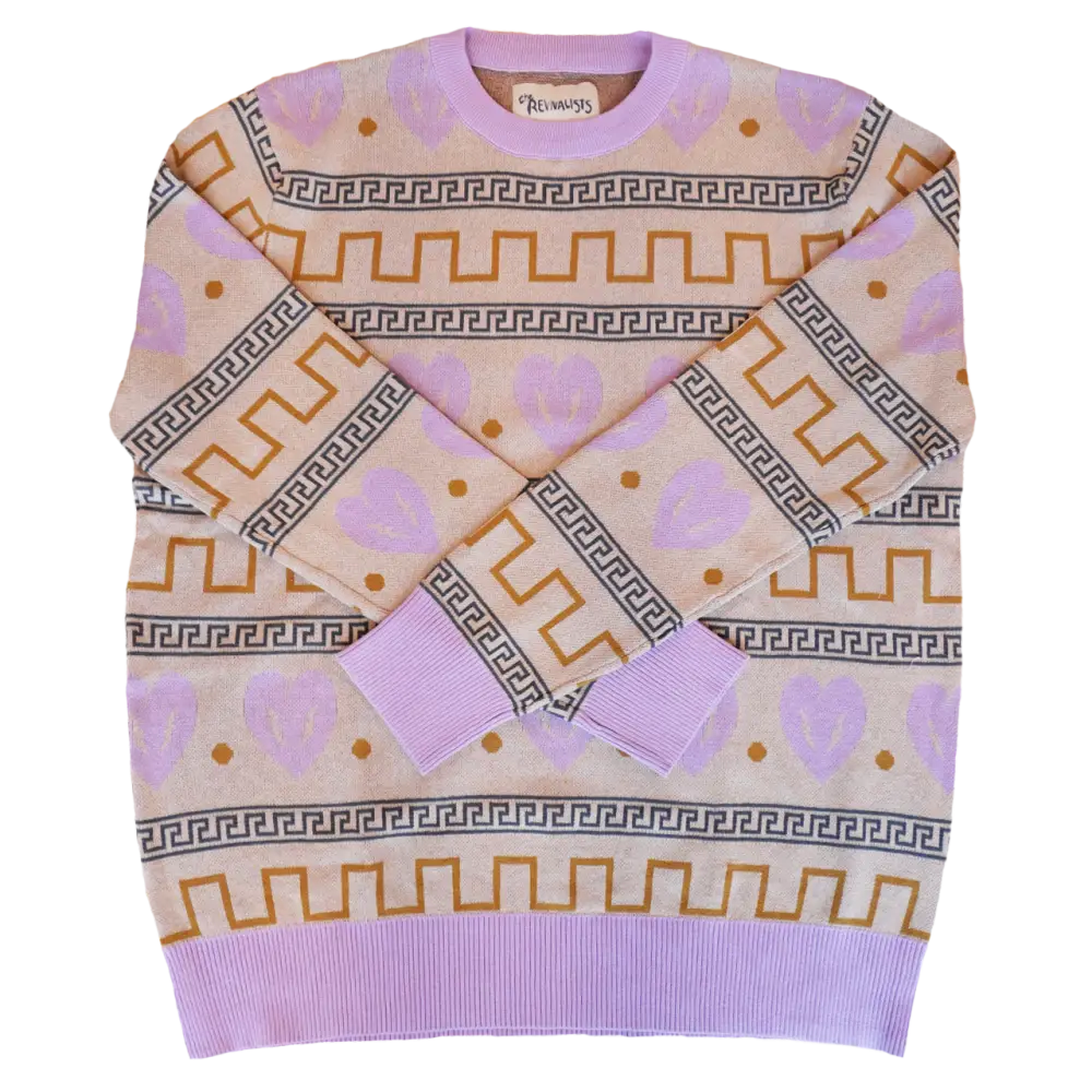 Lavender sweater with geometric patterns in gold and gray.