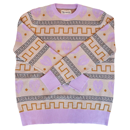 Lavender sweater with geometric patterns in gold and gray.