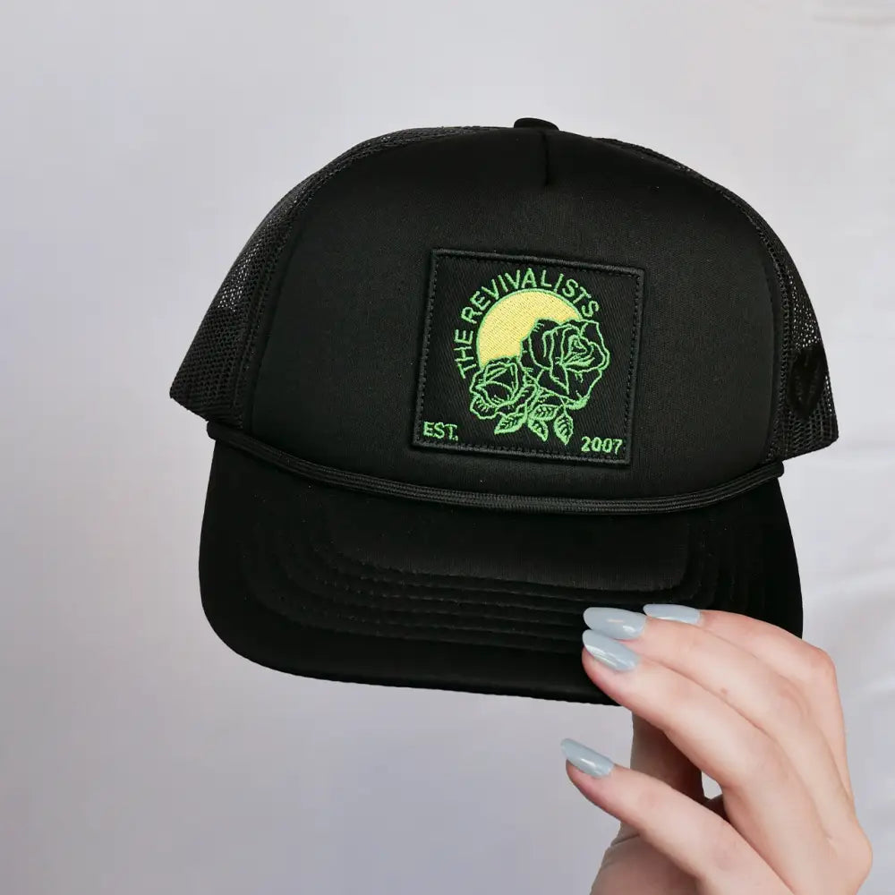 Black trucker hat with a square patch.