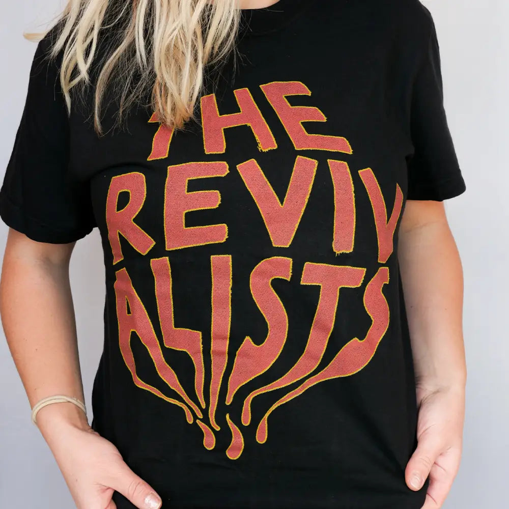 Black t-shirt with ’The Revivalists’ graphic.