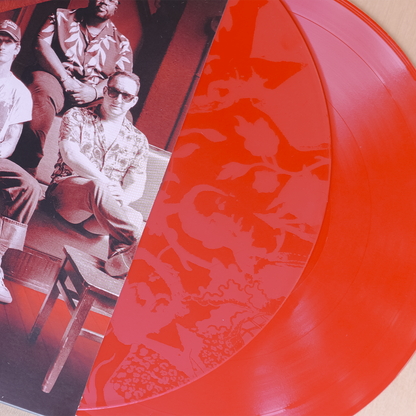 Red vinyl record with band photo.