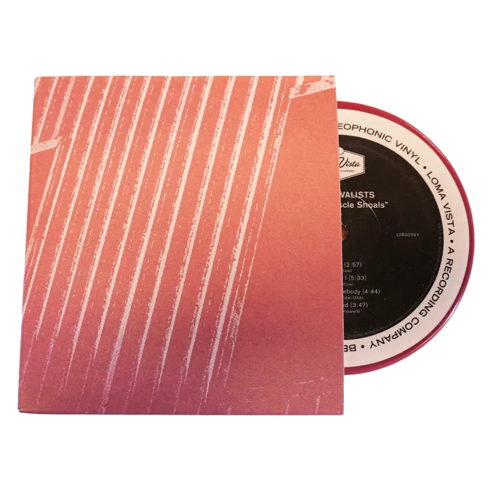 Vinyl record partially removed from its pink and white striped sleeve.